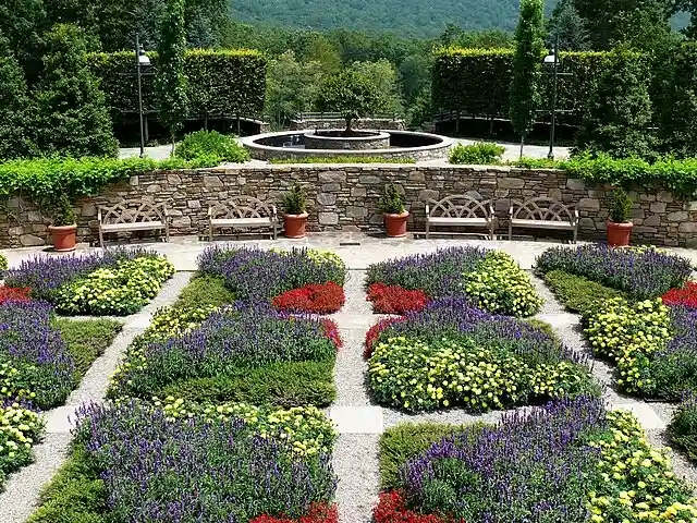 Summer flower quilt garden at NC Arboretum in Asheville with formal design and mountain views