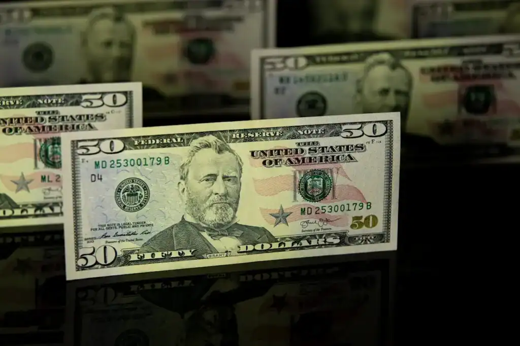 Close-up of $50 bill used to represent Turf TitanZ referral incentive program