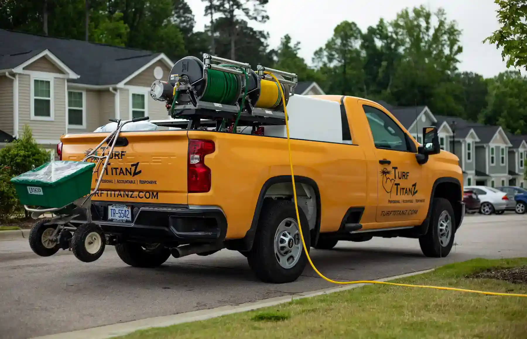 Turf TitanZ truck equipped for hand watering services in Wake Forest
